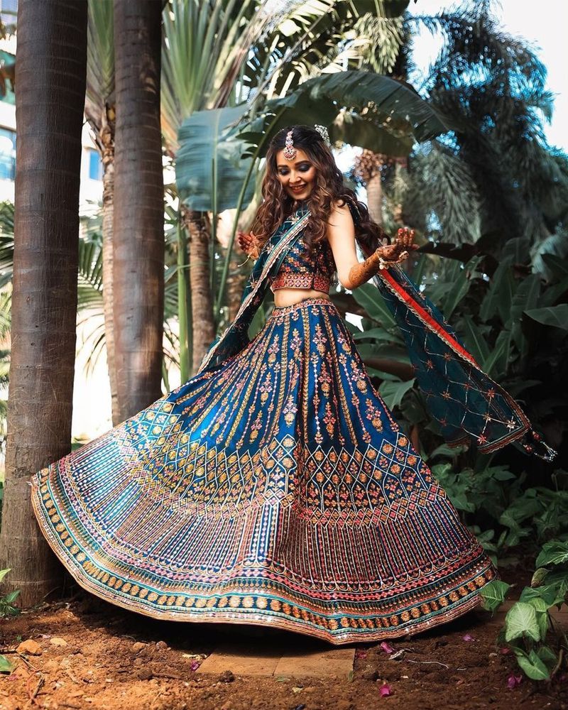 Flamboyant Weaving Green and Orange Banarasi Silk Designer Lehenga Choli
