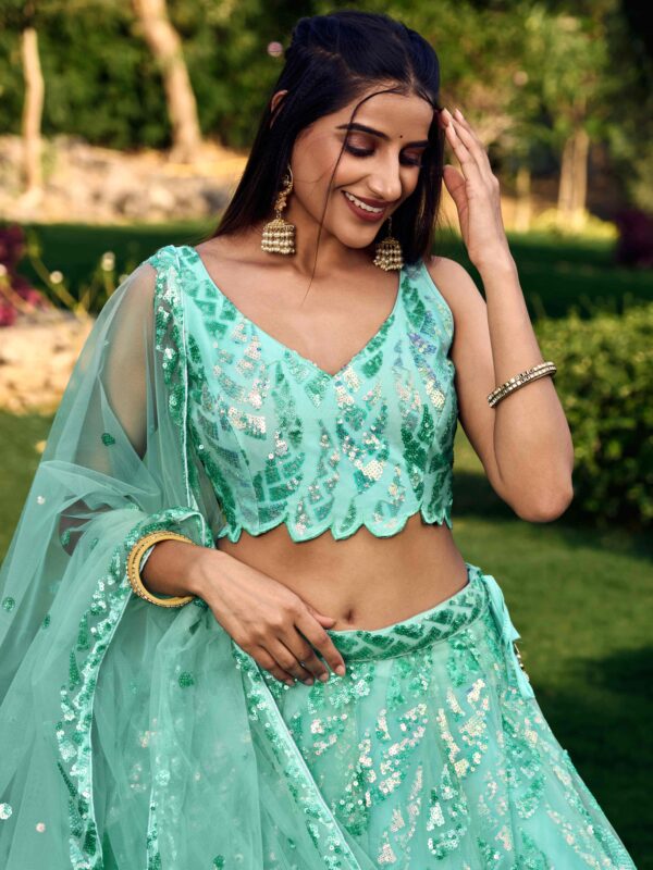 Gorgeous Lehenga With Net Material In Turquoise Blue Color.