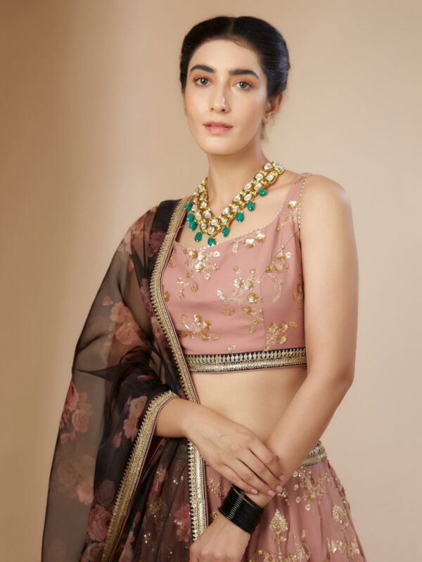 Luxurious Dusty Pink Lehenga Choli With golden sequins Work.